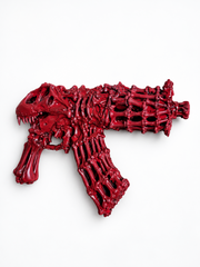 DRACO T-REX rouge — vue de la face opposée et de l’assemblage d’os sculptés